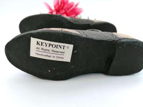 Keypoint miniature pair of shoes