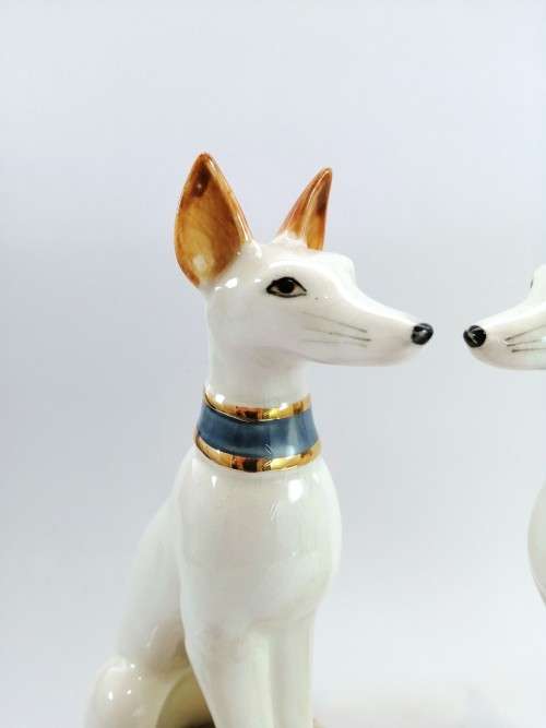 Pair of porcelain tall greyhound statues