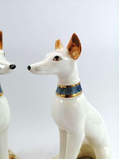 Pair of porcelain tall greyhound statues