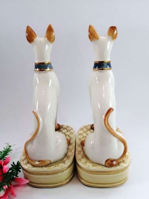 Pair of porcelain tall greyhound statues