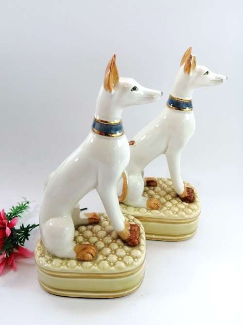 Pair of porcelain tall greyhound statues