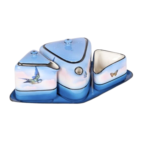 Art Nouveau earthenware three piece tea set decorated with birds and butterflies