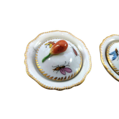 Antique lidded pots showcase charming motifs, including ladybird and butterflies