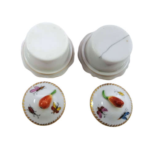 Antique lidded pots showcase charming motifs, including ladybird and butterflies