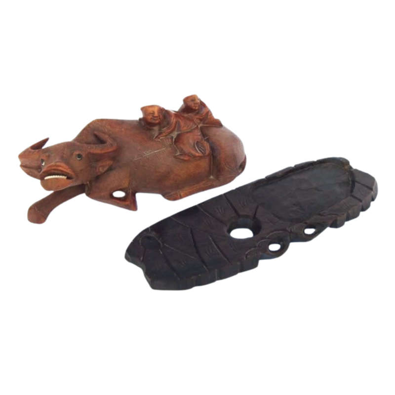 Antique Chinese wood carving depicting an Ox or Water Buffalo with two passengers