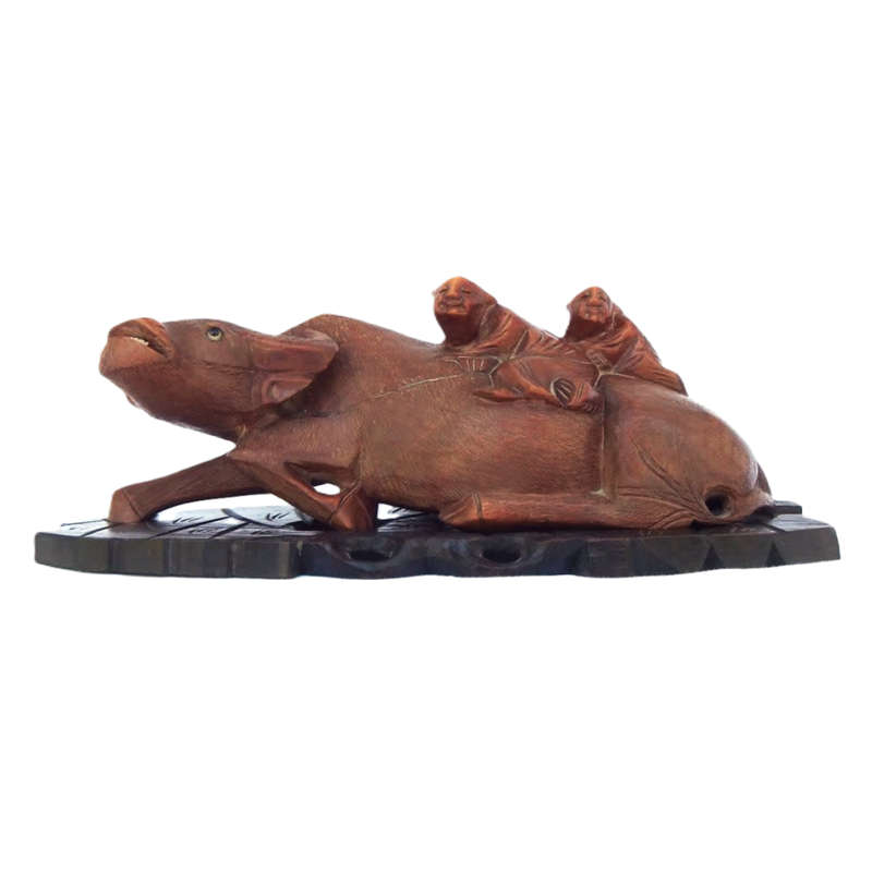 Antique Chinese wood carving depicting an Ox or Water Buffalo with two passengers
