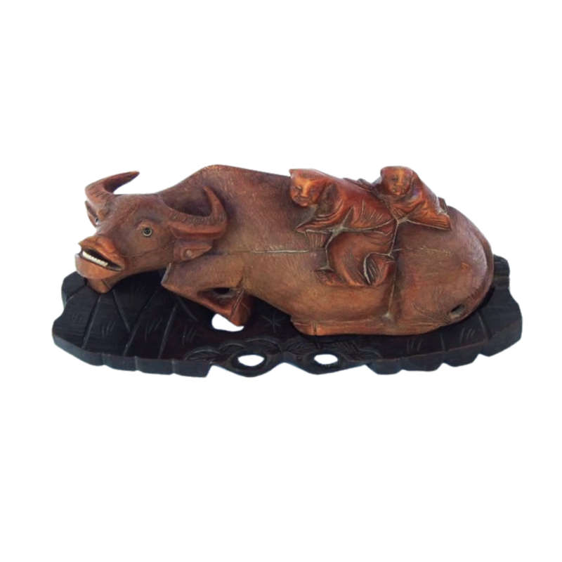 Antique Chinese wood carving depicting an Ox or Water Buffalo with two passengers