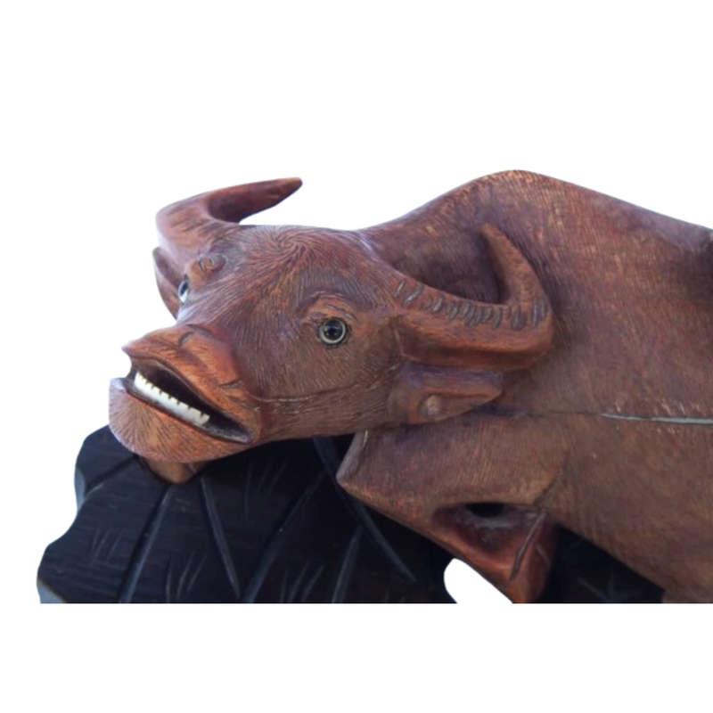 Antique Chinese wood carving depicting an Ox or Water Buffalo with two passengers