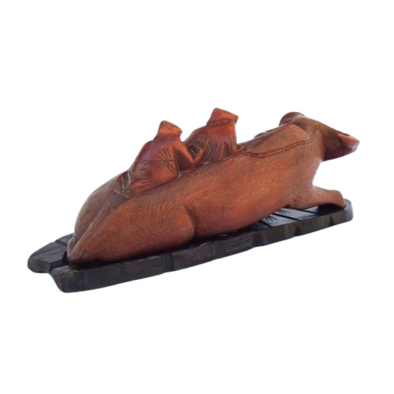 Antique Chinese wood carving depicting an Ox or Water Buffalo with two passengers