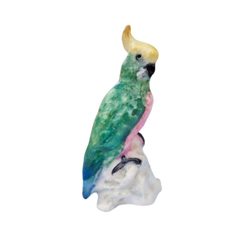 Antique Royal Staffordshire tropical parrot bird figure mounted on a tree trunk base.