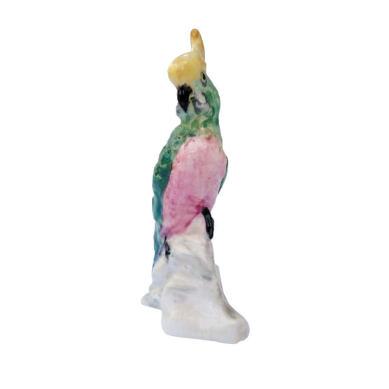 Antique Royal Staffordshire tropical parrot bird figure mounted on a tree trunk base.