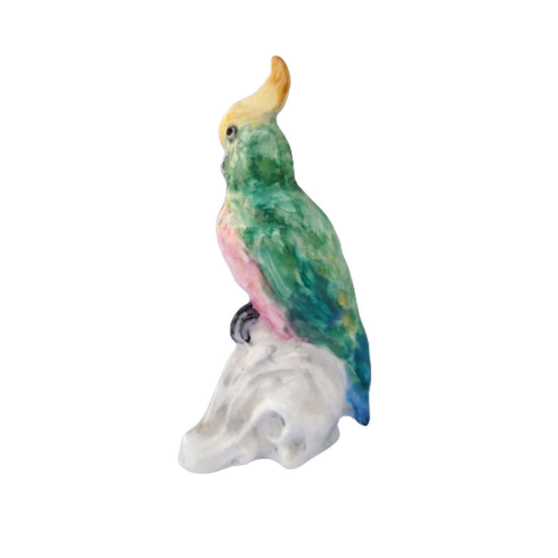Antique Royal Staffordshire tropical parrot bird figure mounted on a tree trunk base.