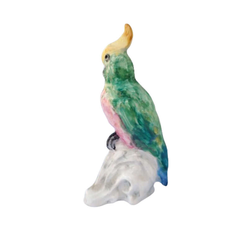 Antique Royal Staffordshire tropical parrot bird figure mounted on a tree trunk base.