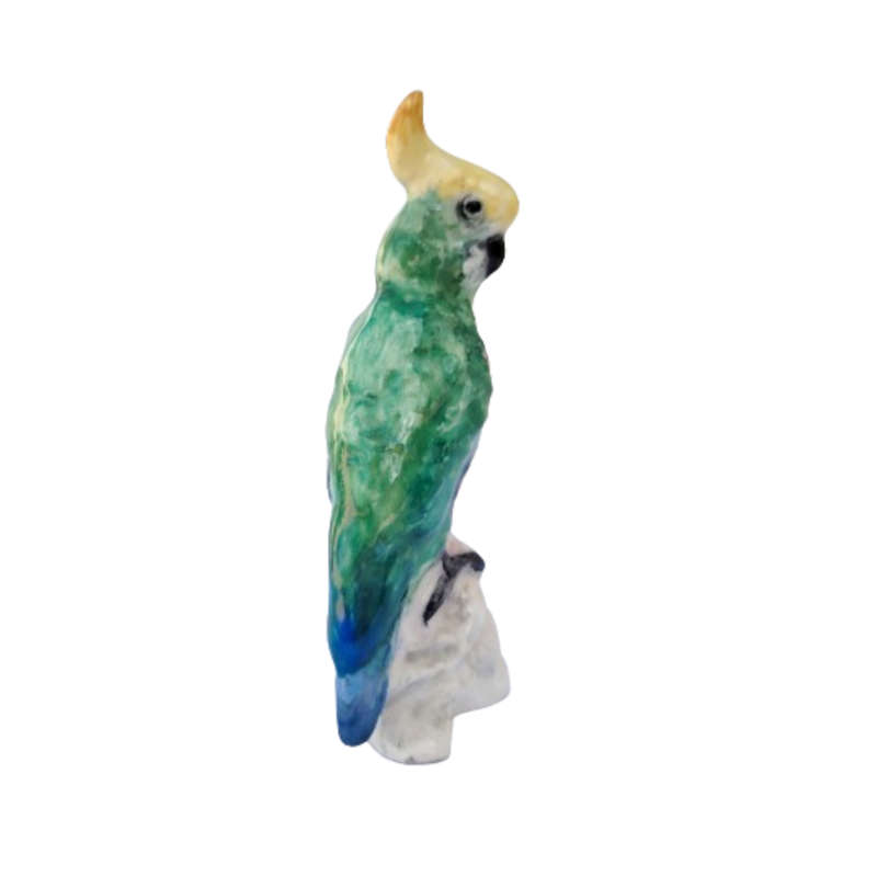 Antique Royal Staffordshire tropical parrot bird figure mounted on a tree trunk base.