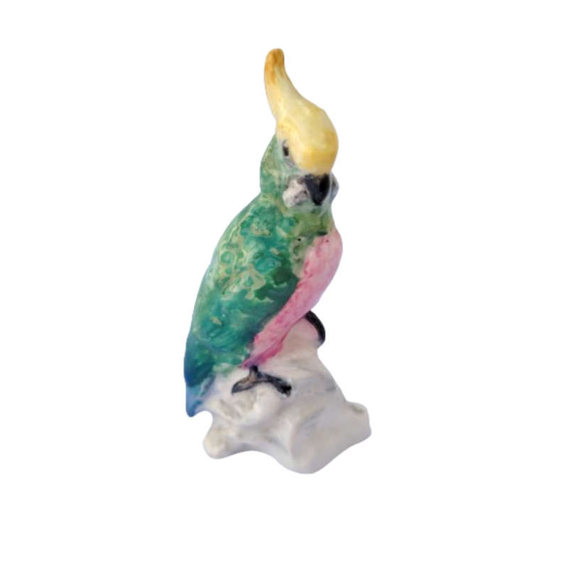 Antique Royal Staffordshire tropical parrot bird figure mounted on a tree trunk base.