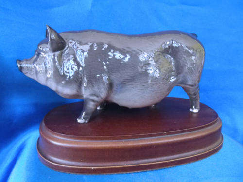Royal Doulton Grey Vietnamese Pot Belly  Pig on wooden plinth