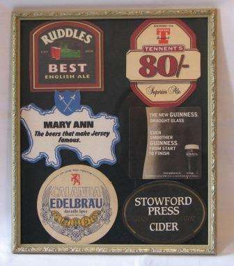 Assorted International Bar Mats Framed.