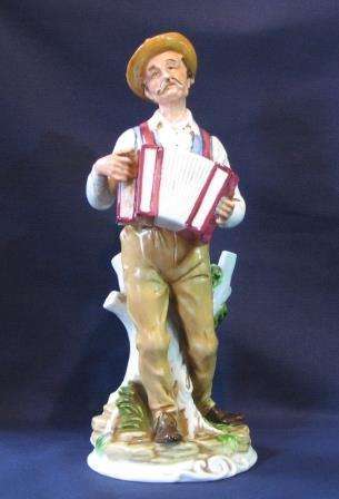 Man with Accordion Porcelain Figurine