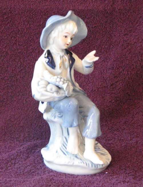 Little Boy Blue with Fruit Basket Porcelain Figurine
