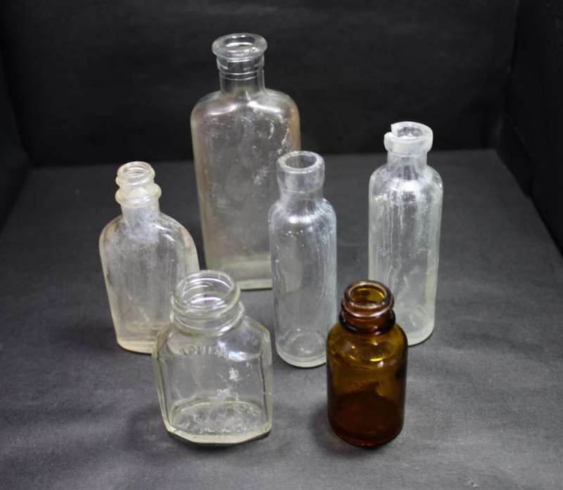 Six Vintage Small Glass Bottles