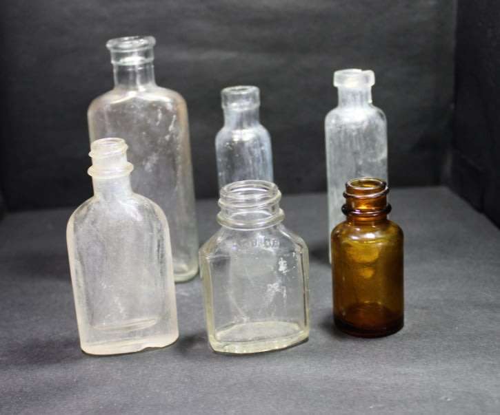Six Vintage Small Glass Bottles
