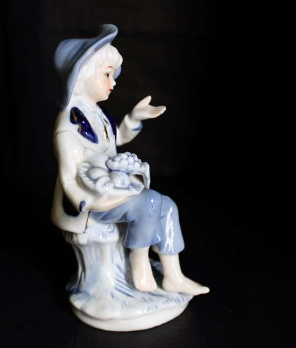 Little Boy Blue with Fruit Basket Porcelain Figurine