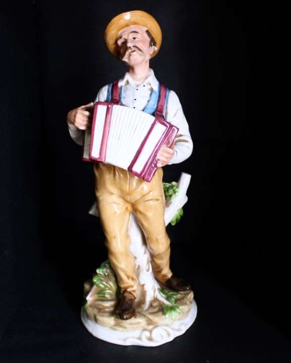 Man with Accordion Porcelain Figurine