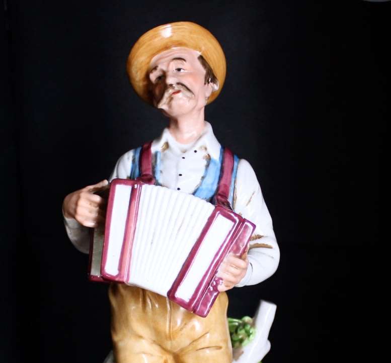Man with Accordion Porcelain Figurine