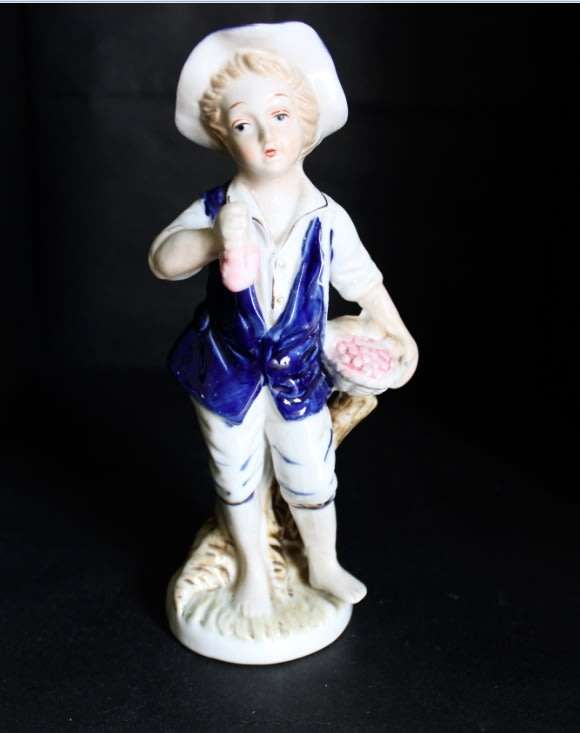 Boy With Fruits  Pocelain Figurine