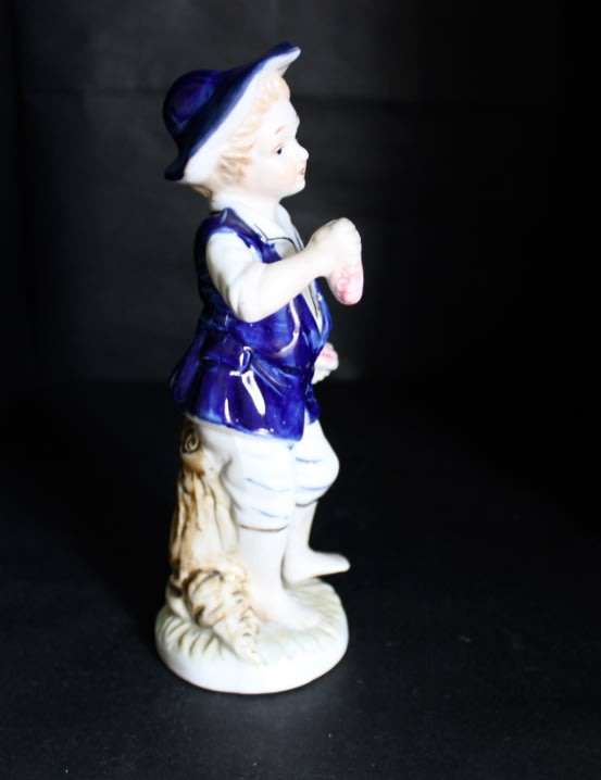 Boy With Fruits  Pocelain Figurine