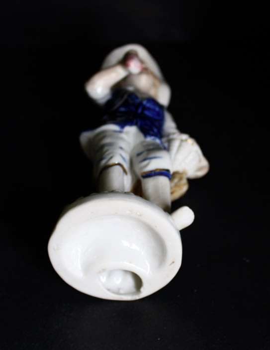 Boy With Fruits  Pocelain Figurine