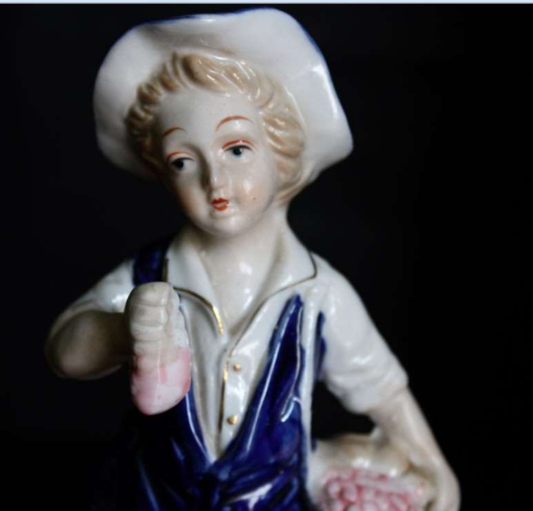 Boy With Fruits  Pocelain Figurine