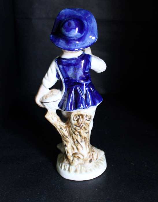 Boy With Fruits  Pocelain Figurine