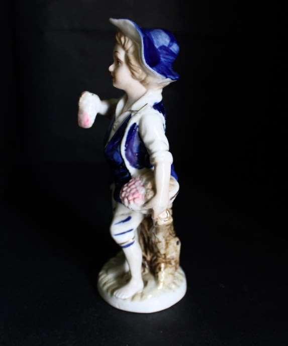 Boy With Fruits  Pocelain Figurine