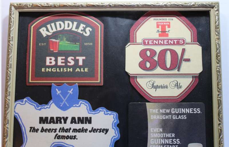 Assorted International Bar Mats Framed.