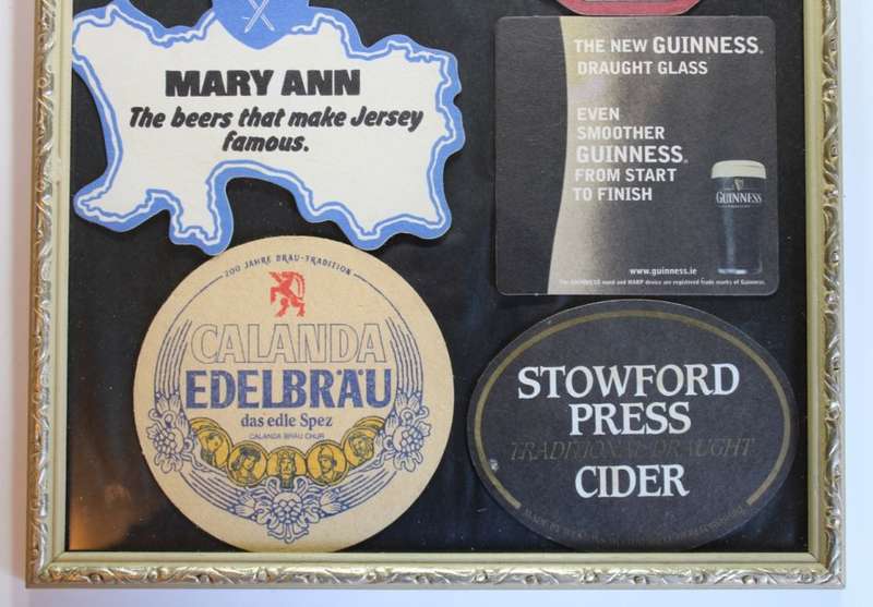 Assorted International Bar Mats Framed.