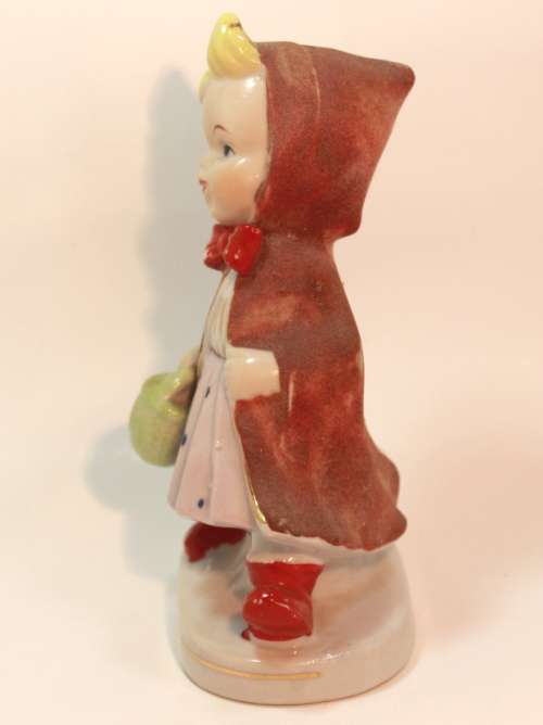 Charming Little Boy and Girl in Hooded Jackets Porcelain Figurines.