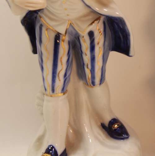 Man and Woman Matching Pair of Porcelain Ornamental Figurines in Victorian Finery.