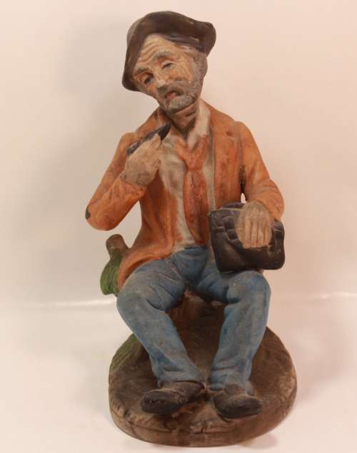 Vintage Porcelain Figurine of Old Man with Tobacco Pouch and Pipe