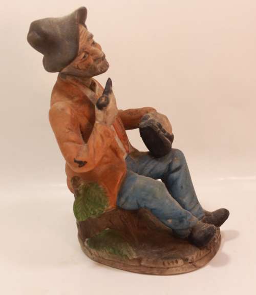 Vintage Porcelain Figurine of Old Man with Tobacco Pouch and Pipe