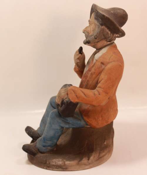 Vintage Porcelain Figurine of Old Man with Tobacco Pouch and Pipe