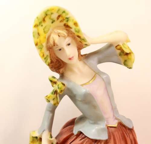 Statuesque Lady with Bonnet and Fan Figurine