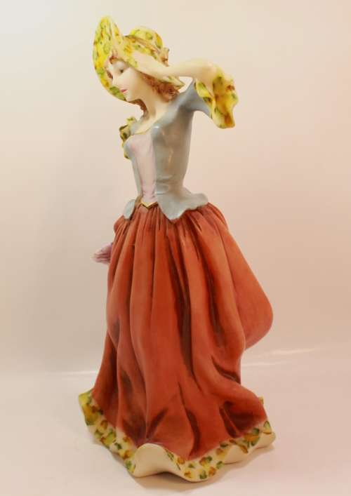 Statuesque Lady with Bonnet and Fan Figurine