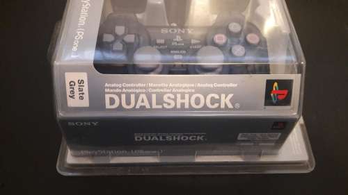 PS ONE Dual shock slate grey remote in original packaging