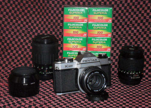 Pentax K1000 + 3x lenses + 10 rolls of expired Fujifilm Superia 100 (24 exposures)