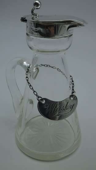 Whisky Noggin with hallmarked silver lid and label. HB Johnson and Company, B/ham 1910. 11cm