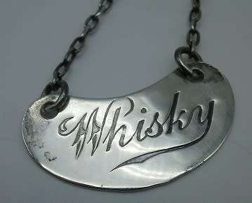 Whisky Noggin with hallmarked silver lid and label. HB Johnson and Company, B/ham 1910. 11cm