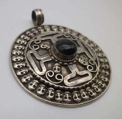 Large Sterling silver designer Skull pendant with central black Tigers Eye.