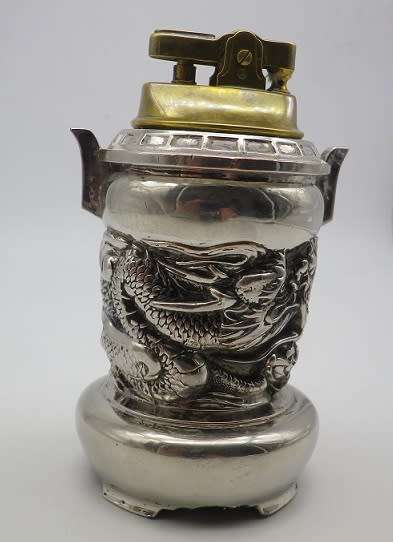 Unusual vintage dragon musical table lighter. Plays AULD LANG SYNGE. Chrome plated