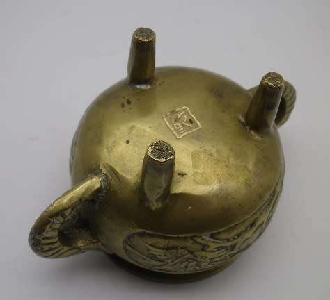 Vintage Chinese solid brass small pot on three legs with dragon motif & elephant handles